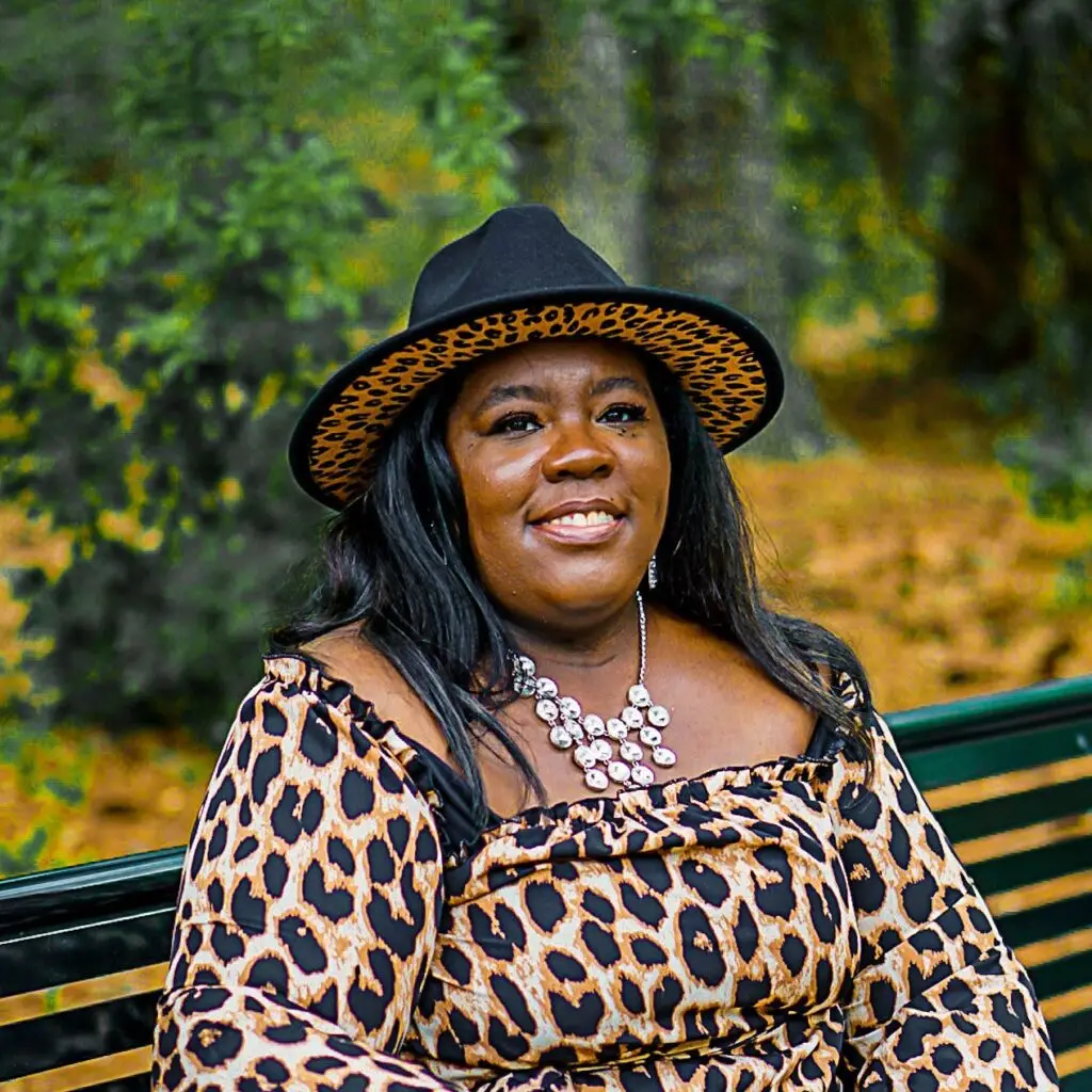 About Us 1 a woman sitting on a bench