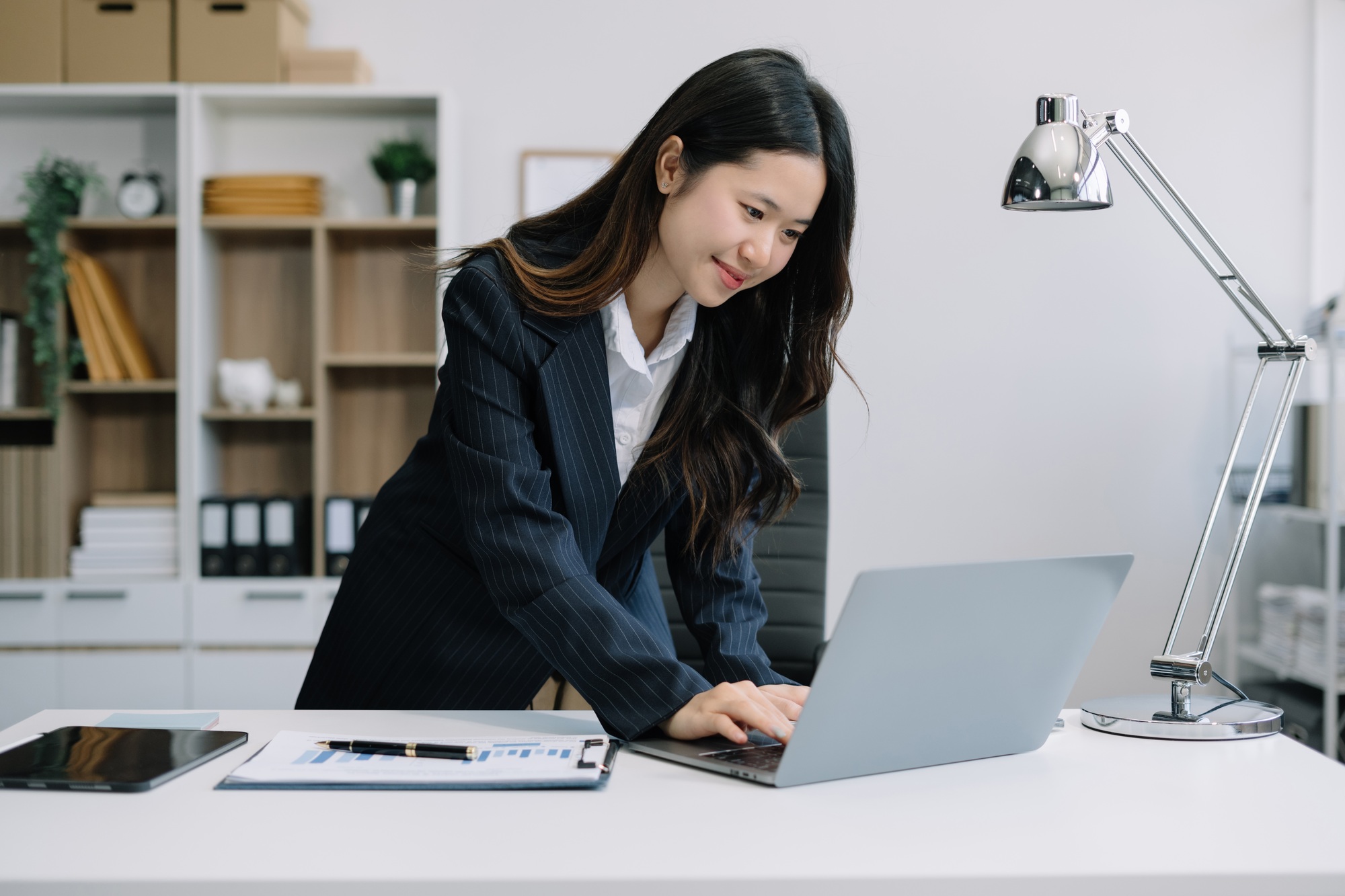 Business people working in the work area with laptop and tablet at the desk. business concepts.